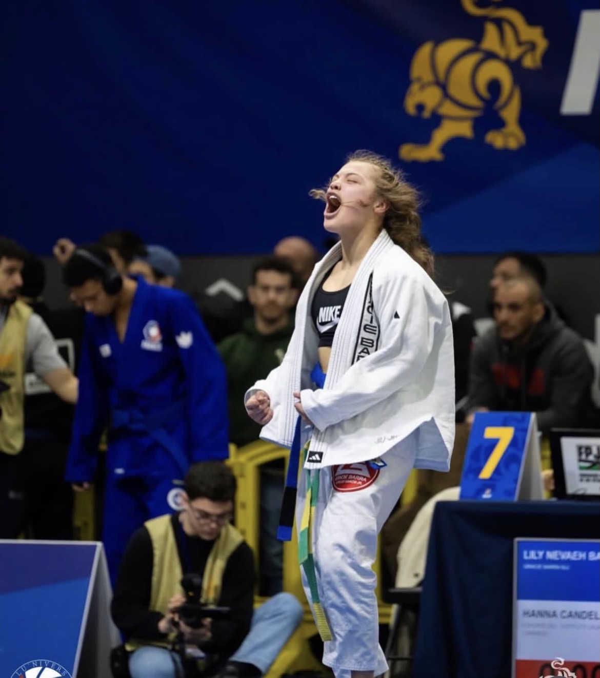 Lily celebrating a win on the competition mat
